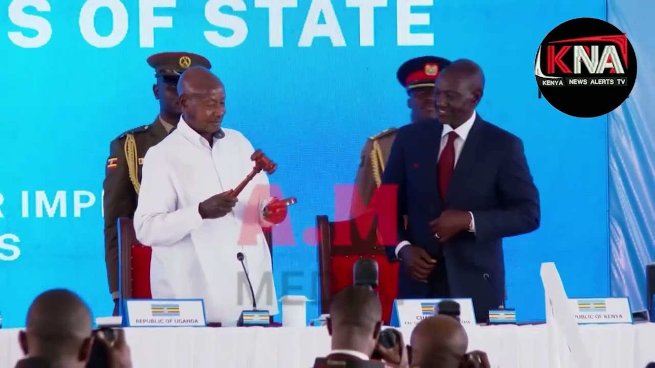 President Ruto officially hands over the chairmanship gavel to President Yoweri Museveni.