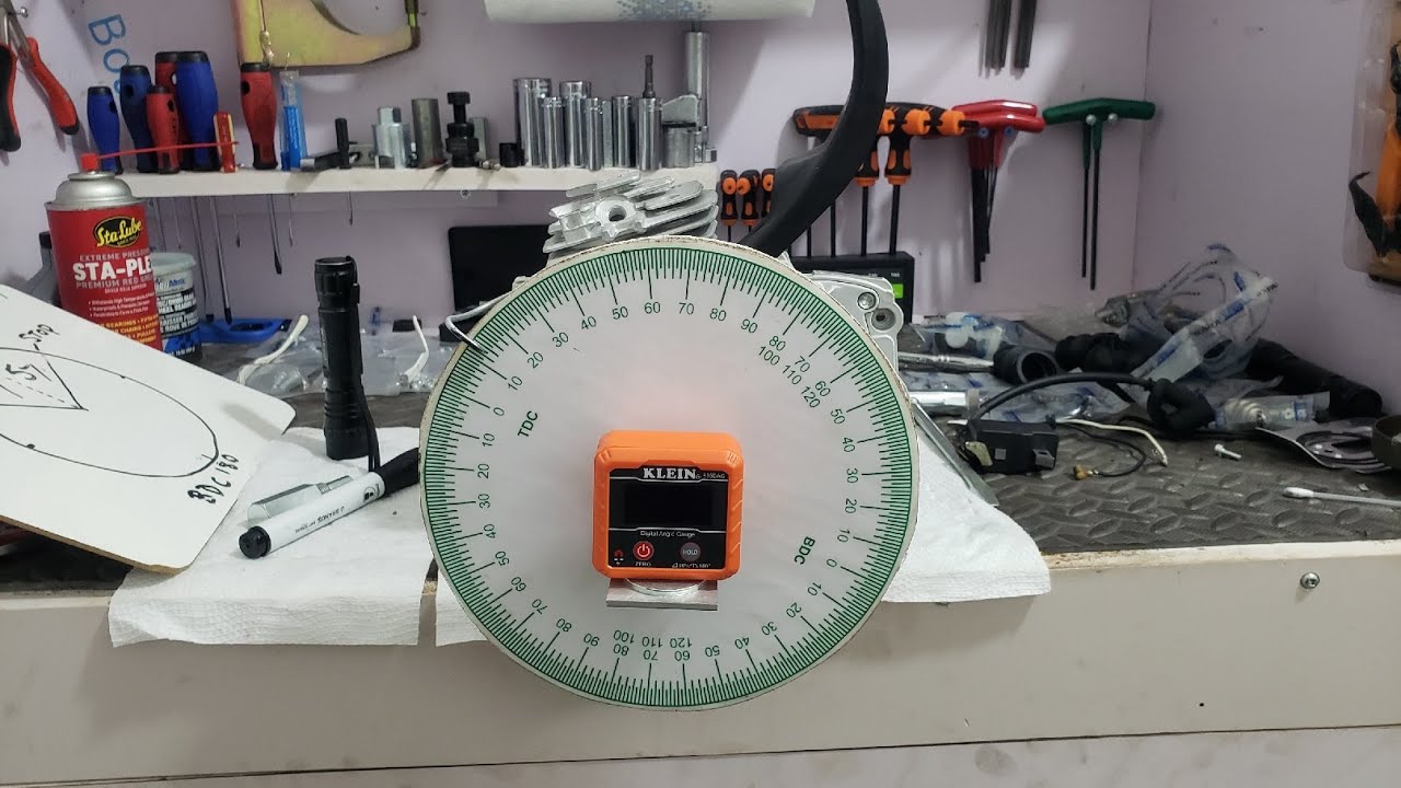 Timing wheel and Digital angle gauge setup for timing a chainsaw