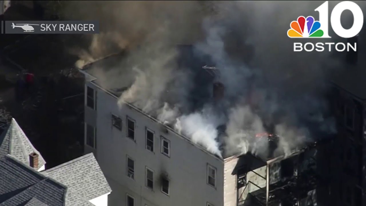 Firefighters rescue woman from burning Somerville home