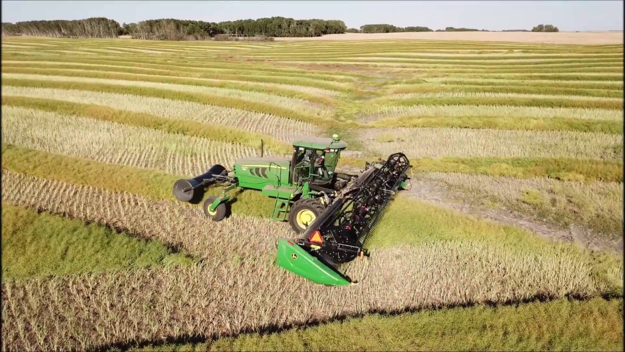 Drone filming John Deere W150 swather