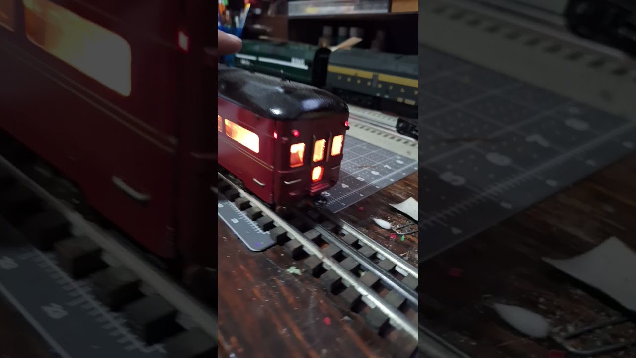 2 rail observation car is lite up and on gargraves track 3 rail.. 