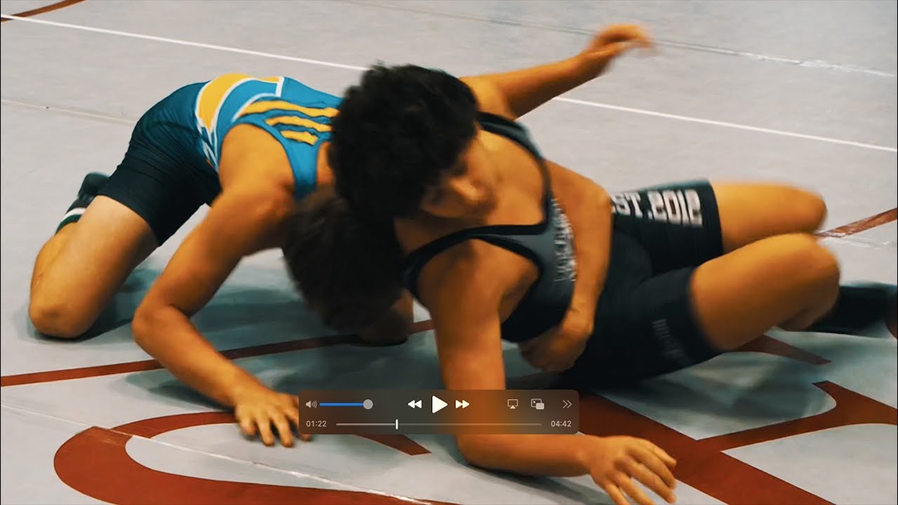 Jordan Mokhtarian of Glenbrook North [R] and Landon Johnson of Johnsburg High School [G] (133-137)