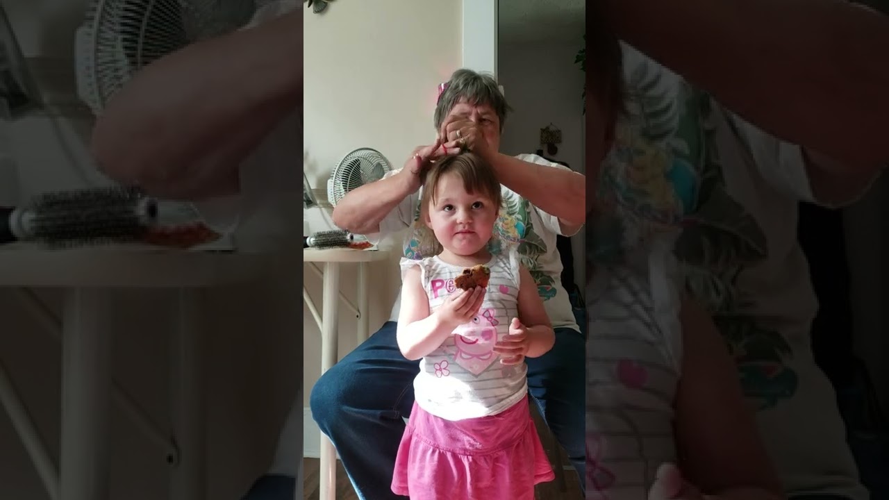 grandma brushing kensley's hair