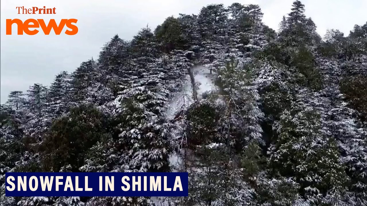 Drone visuals of snow-covered mountains in Shimla