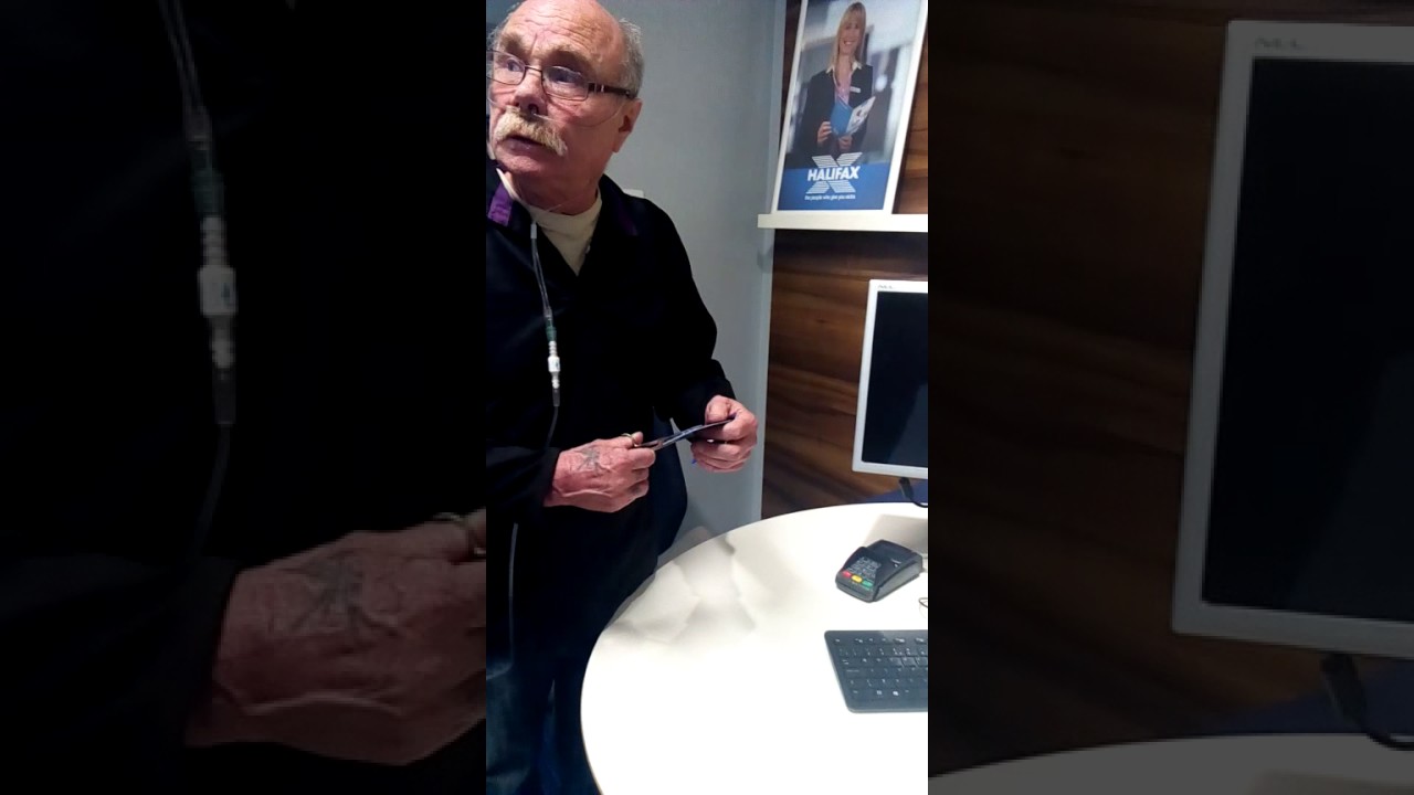 Angry Halifax customer chopping his bank card.