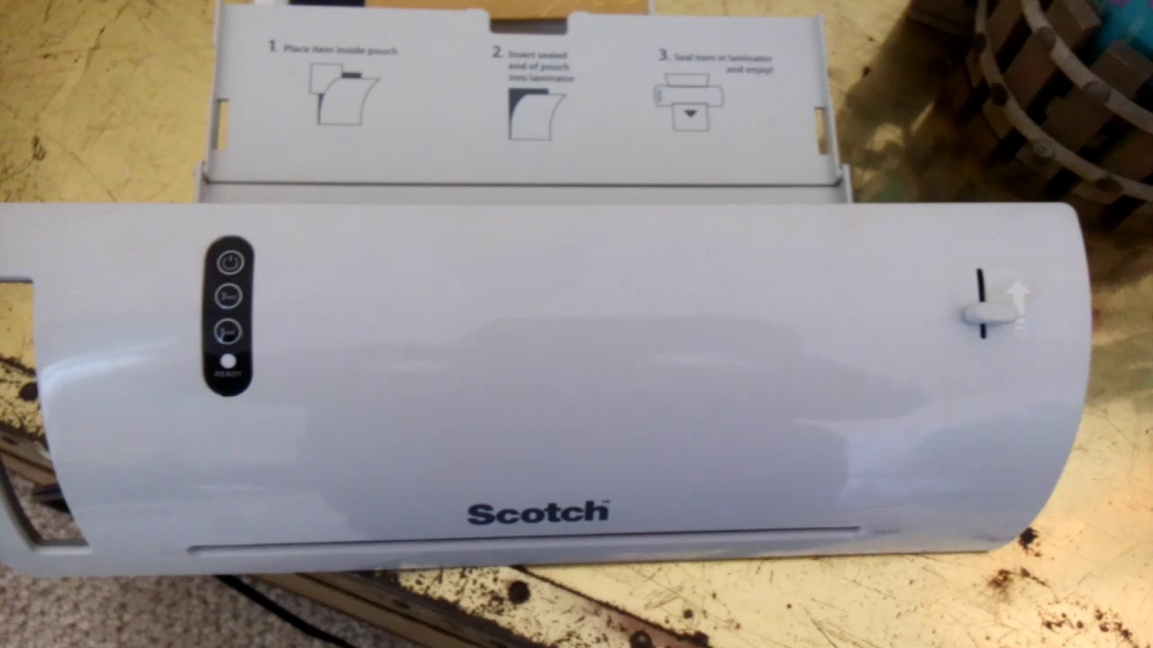 How to close tray on Scotch laminator.