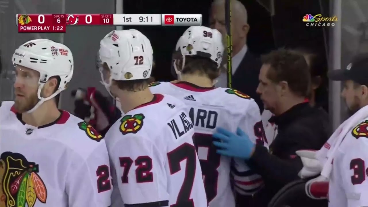 Connor Bedard takes a huge hit from Brendan Smith