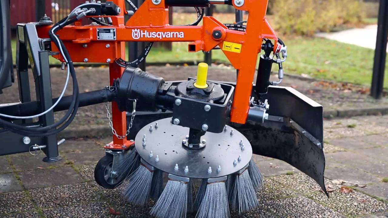 How the weed brush attachment on a Husqvarna front mower works