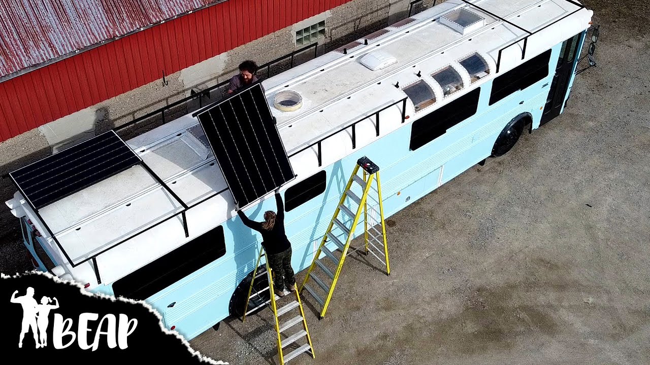 We Were Nearly BLOWN OFF THE ROOF (Erecting Skoolie Solar Panels In Wild Winds)