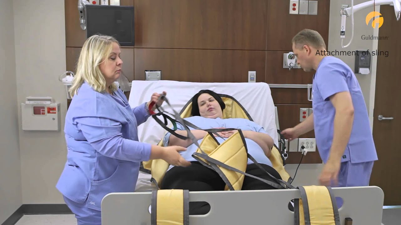 Guldmann Ceiling Lift: Bariatric Basic High - Lifting from bed to chair
