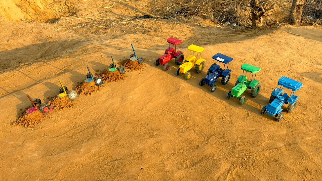 Shovels are placed on top of the tractor trolley and heavy soil is in the trolley!#198