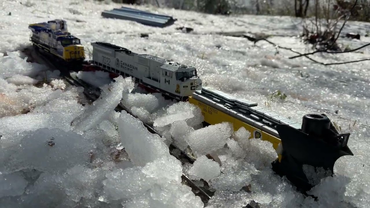 Lionel legacy engines plowing, thick ice in garden railway 