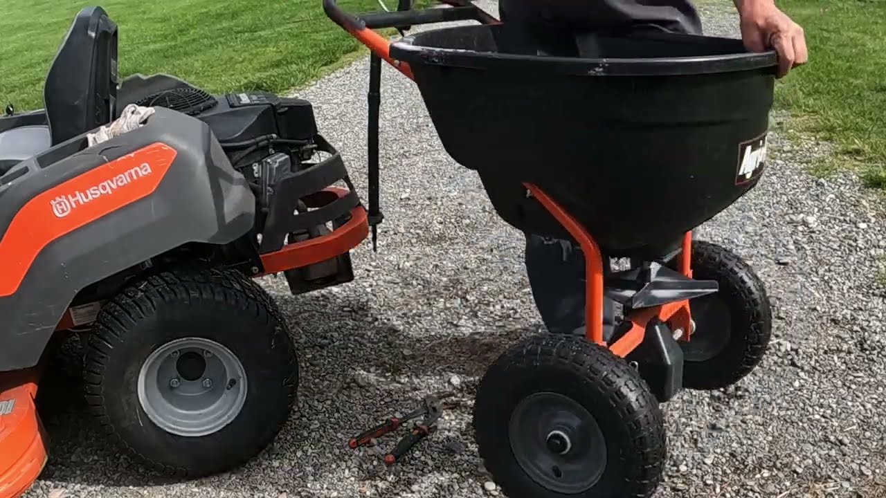 Converting a push lawn spreader to a pull lawn Spreader.