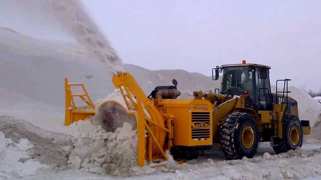 Larue D87 single-stage snow blower operating at snow dump site