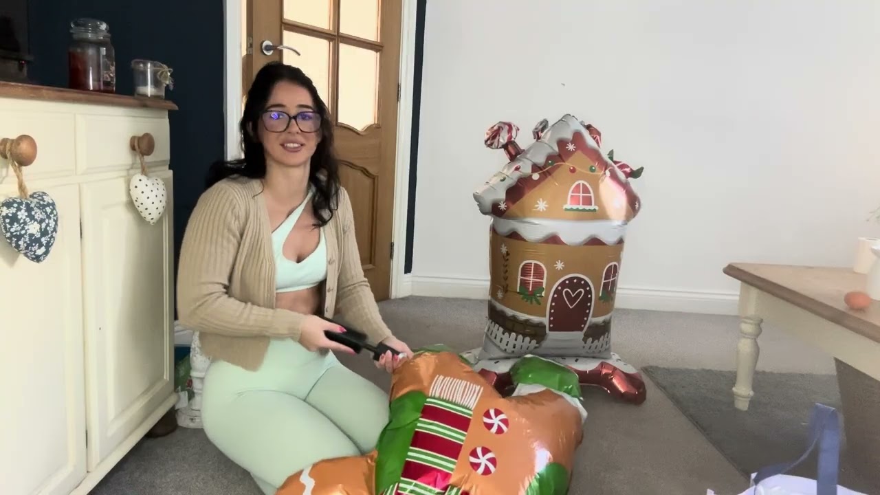 Blowing up Mylar (foil) themed Christmas balloons 