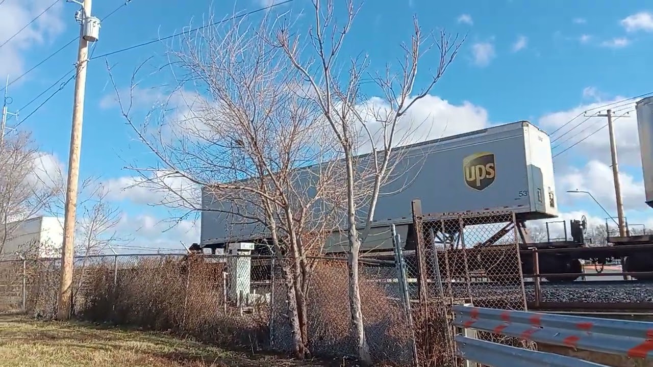 BNSF gevo 3918 leading z train over million dollar bridge in down town kansas city missouri 
