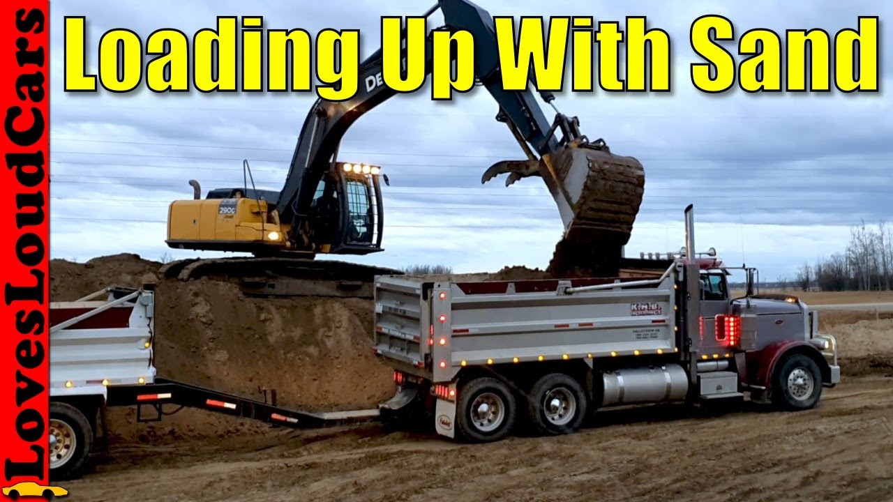 John Deere 290C Excavator loading sand