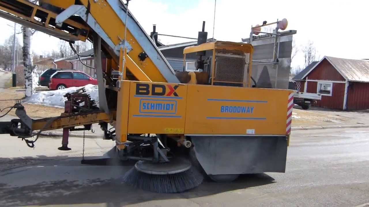 Scania R124 with a Trailer sweeping machine ,Volvo L70F with sweeper