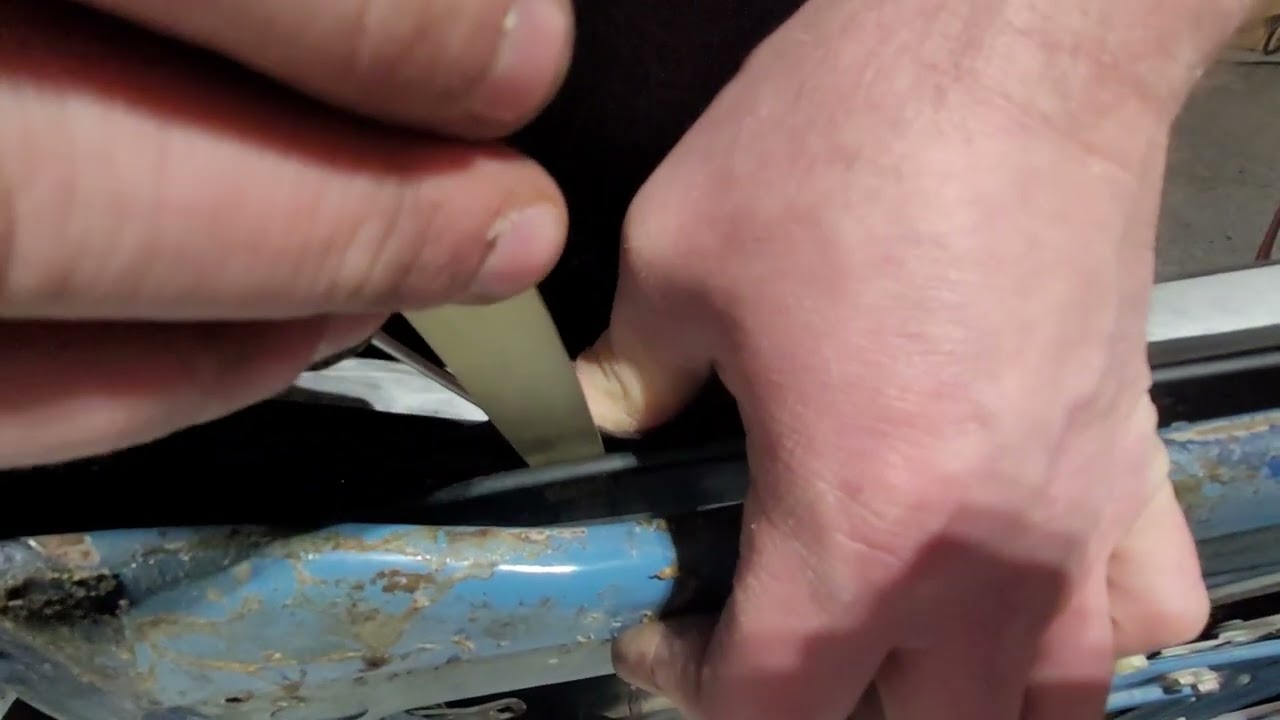 Installing Triumph Tr6 door glass weather stripping.