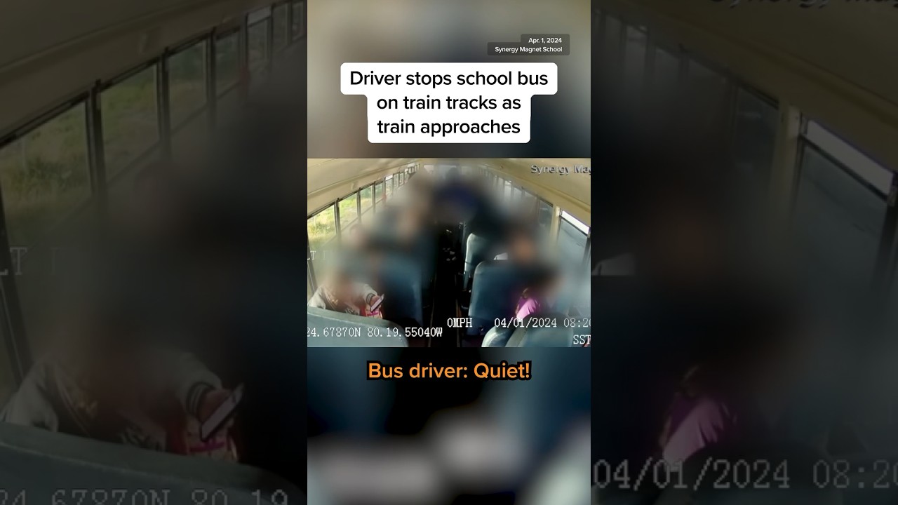 Driver stops school bus on train tracks as train approaches