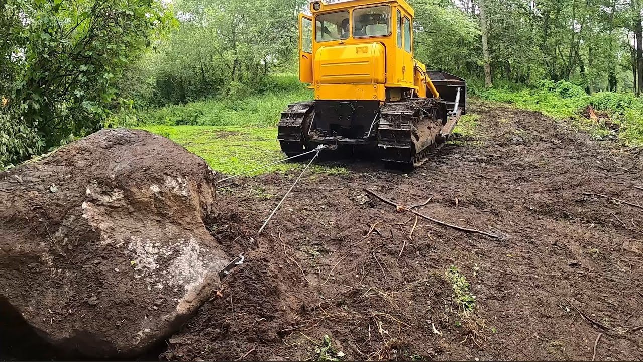 Moving a giant boulder with a bulldozer
