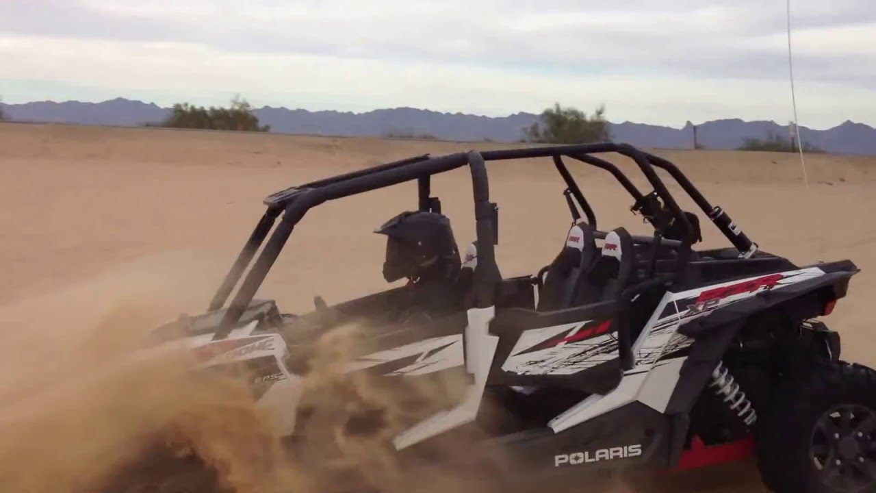 Polaris RZR XP4 1000 jumping at Glamis