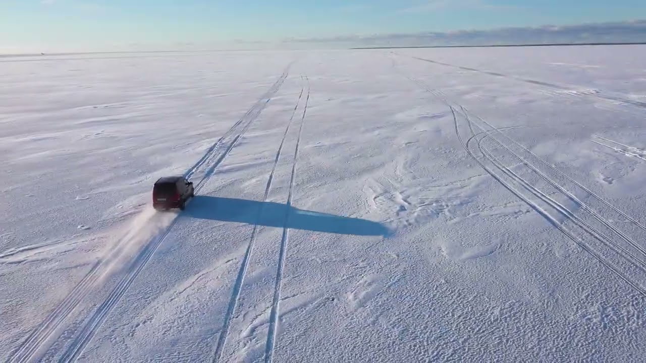Driving Across the Frozen Baltic Sea to an Island, Photography Bernhard Lang