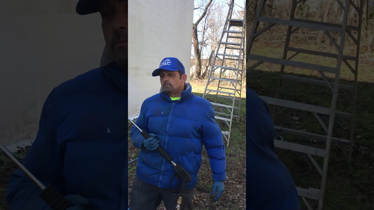 Using M5 X-Jet cleaning a three story painted brick wall.