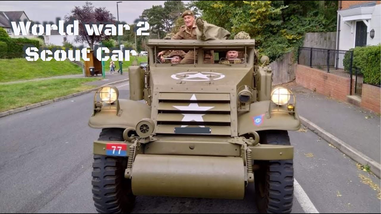 ww2 white scout car driving behind us