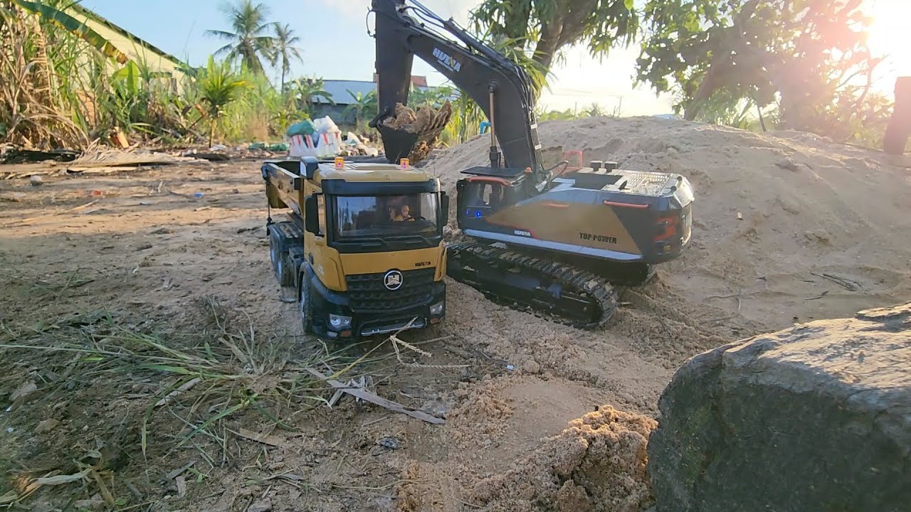 RC Dump Truck and Excavator Working on a Sandbox Construction Site