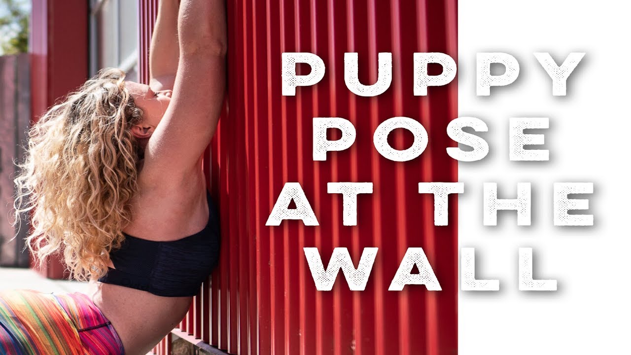 Pose Breakdown: Puppy Pose at the Wall