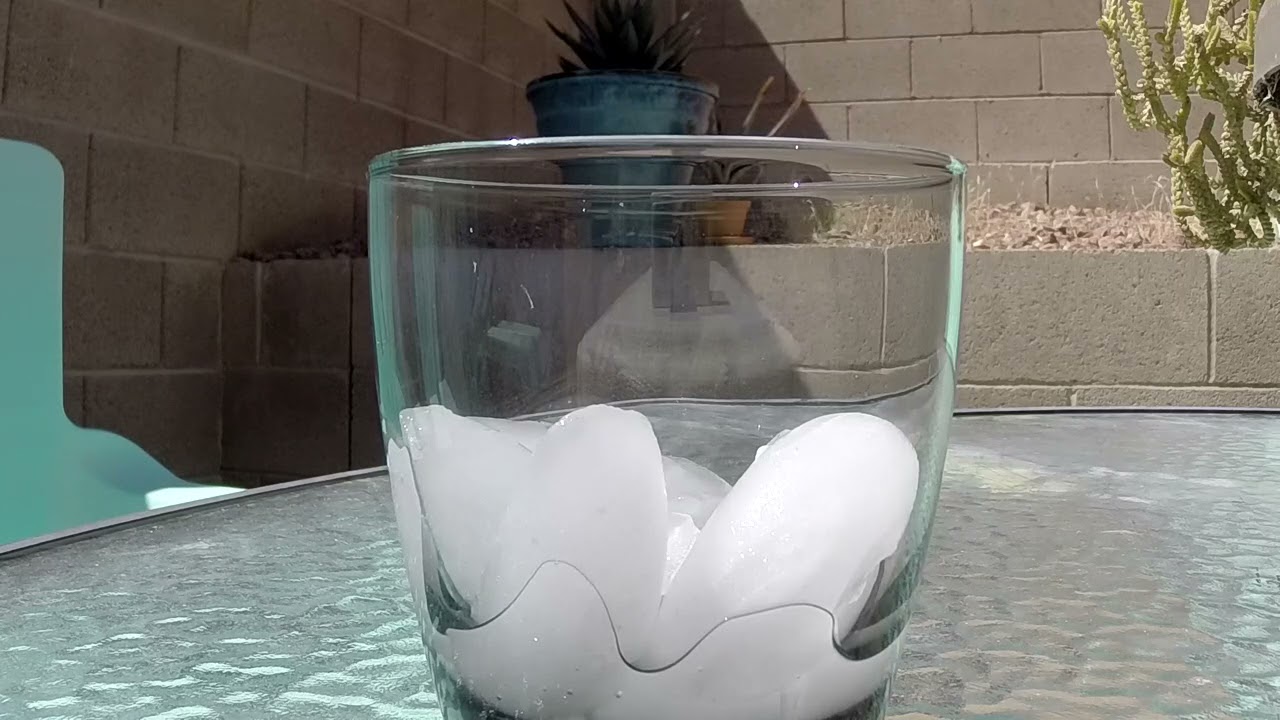 Ice melting in a glass for an hour.