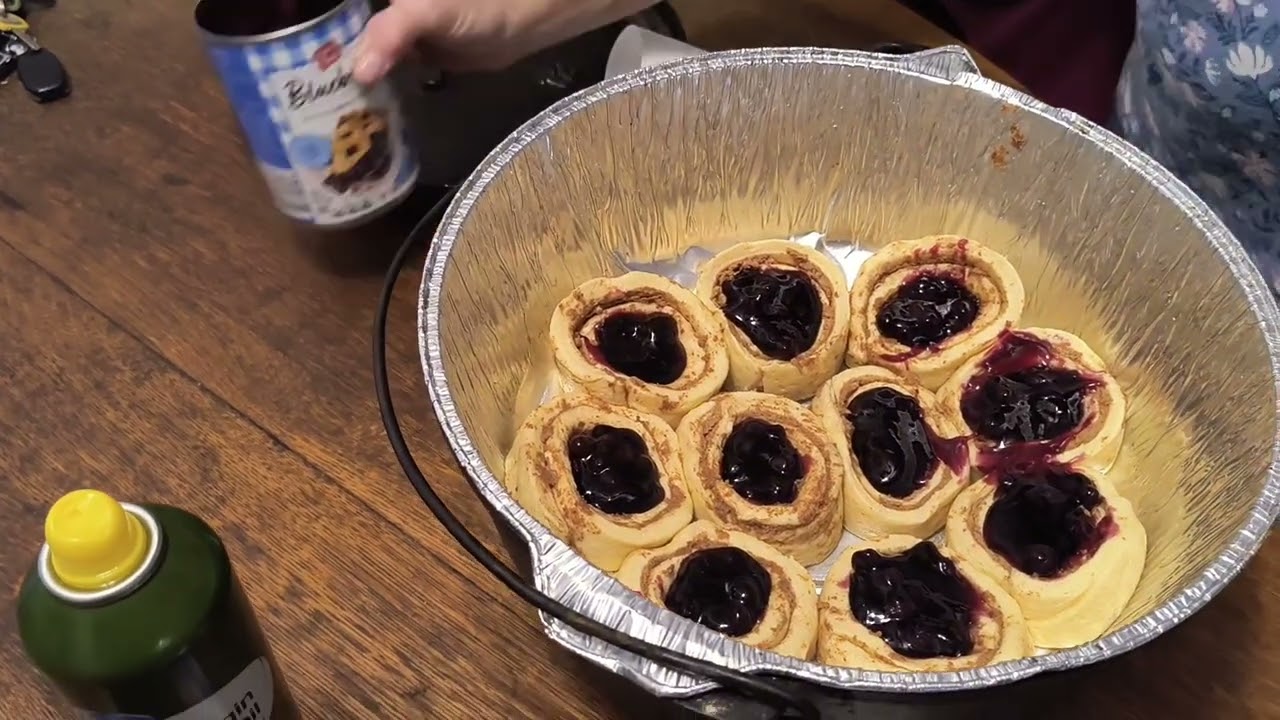 Blueberry cinnamon rolls pie in a Dutch Oven 
