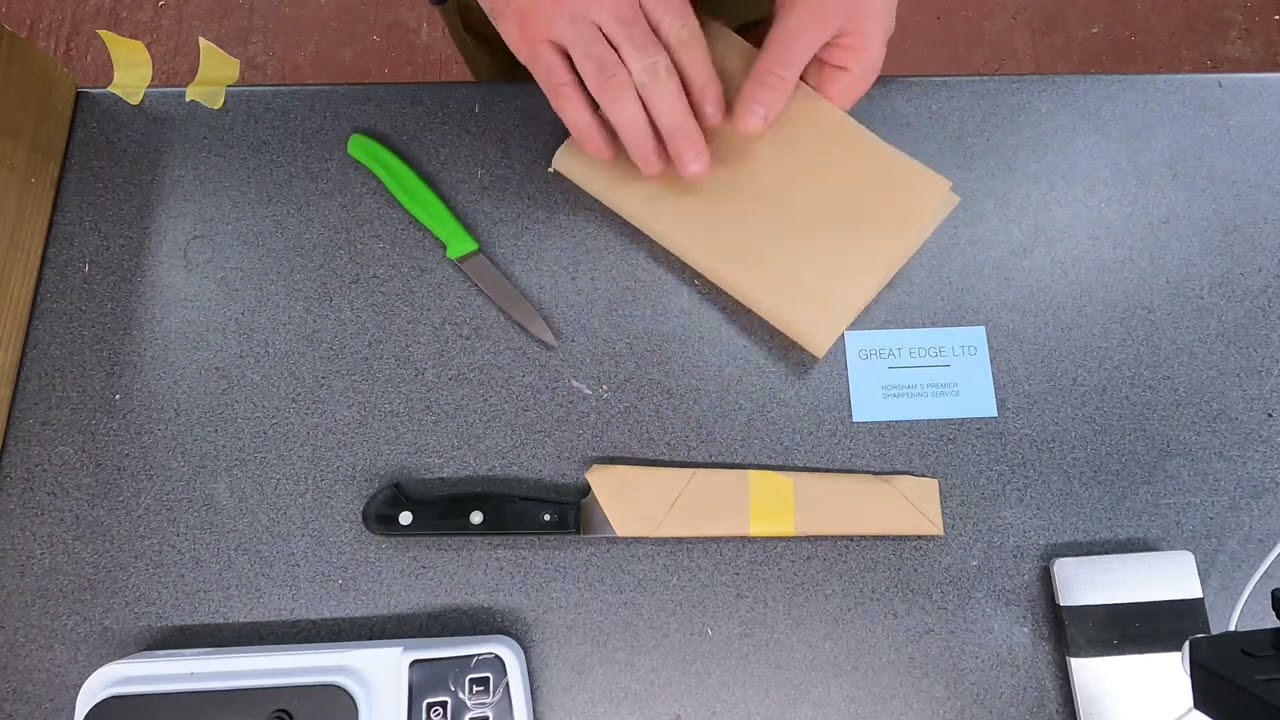 Wrapping/packing knives after sharpening, ready to return to customer.