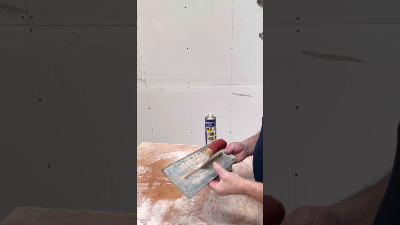 Using a wet stone to help improve the edge of your finishing trowel.