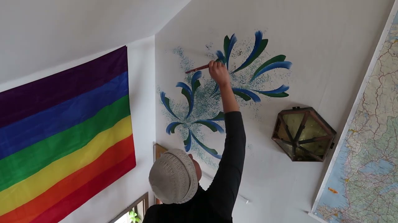 Painting flowers on a wall in Lunden collective