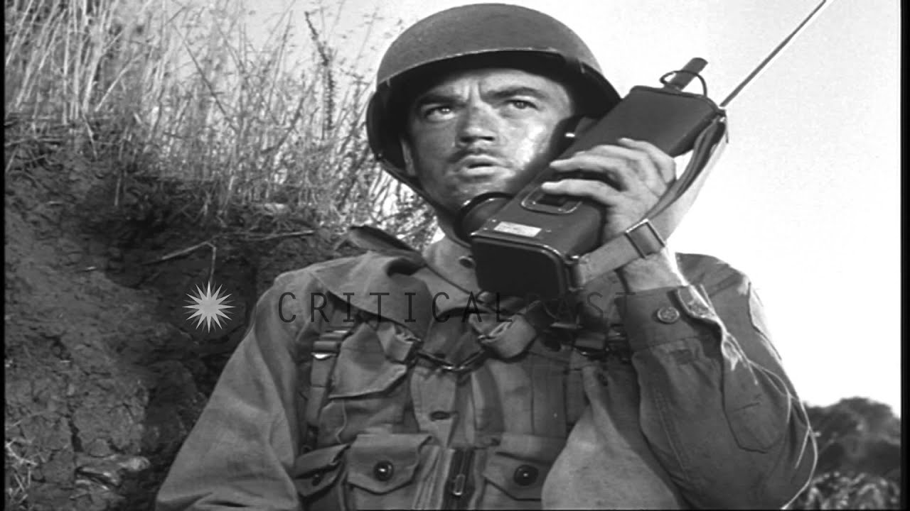 Reenactment: A US soldier talks over a handie talkie and another speaks over a fi...HD Stock Footage