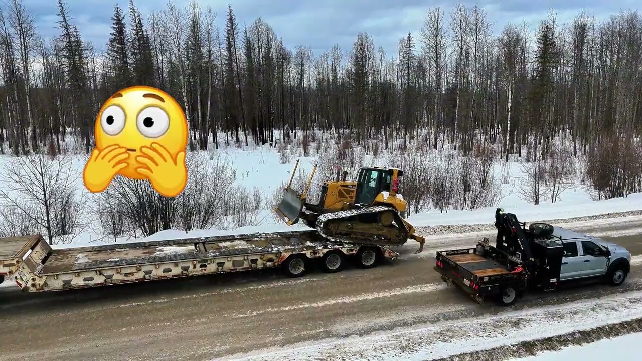 Lowboy day loading unloading a D6 cat