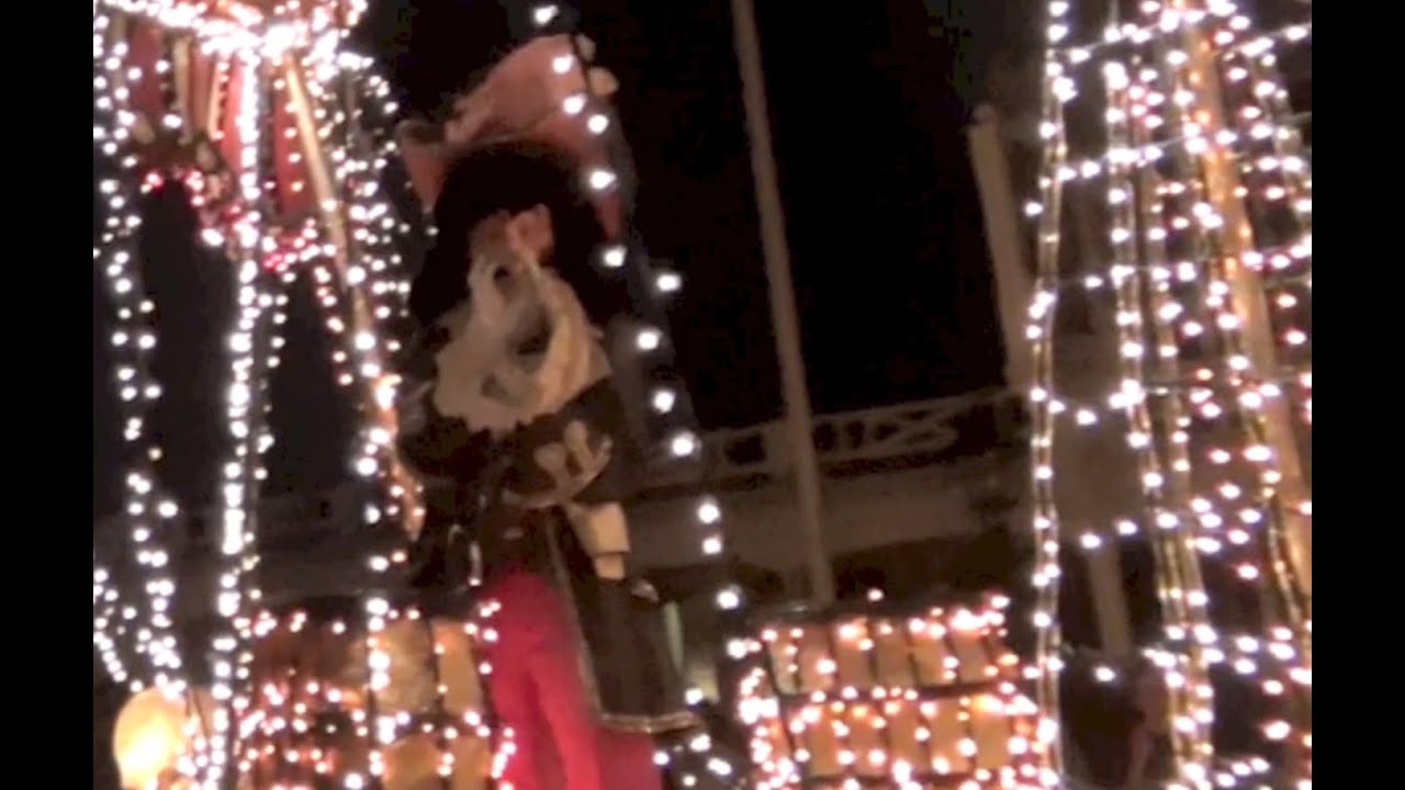 Tommy starts Making heart signs to characters at the night parade