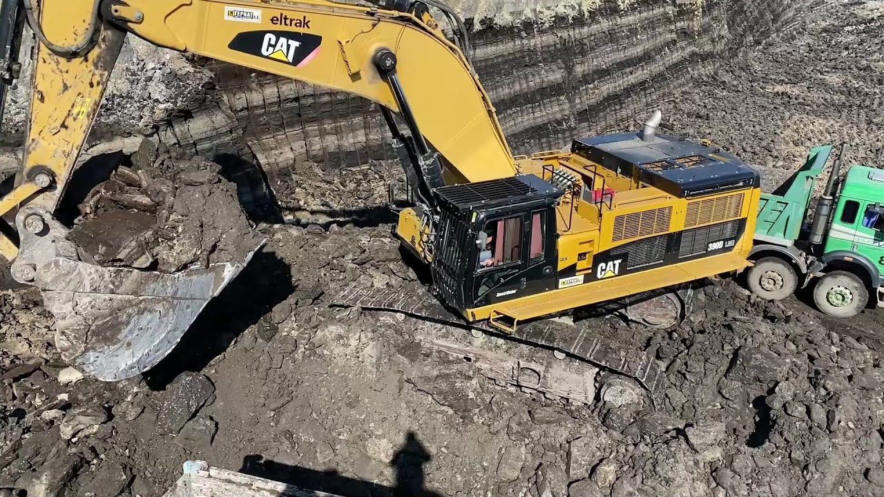 Caterpillar 390D Excavator Loading Mercedes And MAN Trucks - Interkat SA
