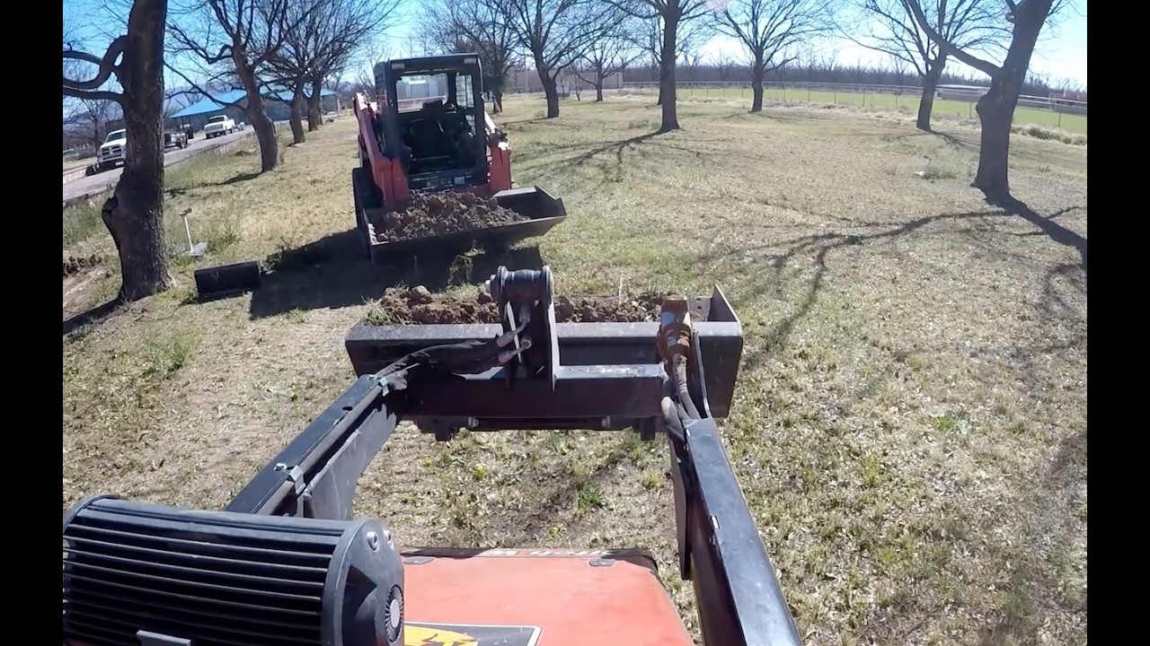 DITCH WITCH SK800 AND KUBOTA SVL 65-2 TAG TEAM GRADING JOB