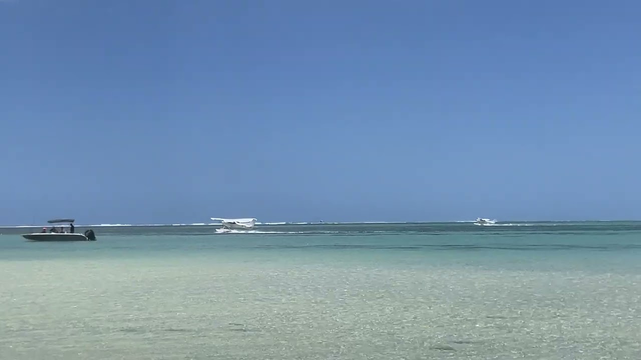 Lagoonflight twin Sirius TL3000s taking off at La Prairie beach, Mauritius