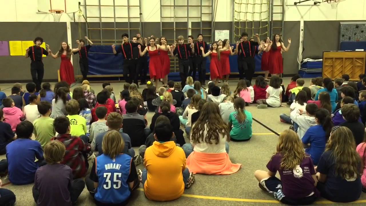 Bellingham High School Showstoppers perform medley at Roosevelt Elementary