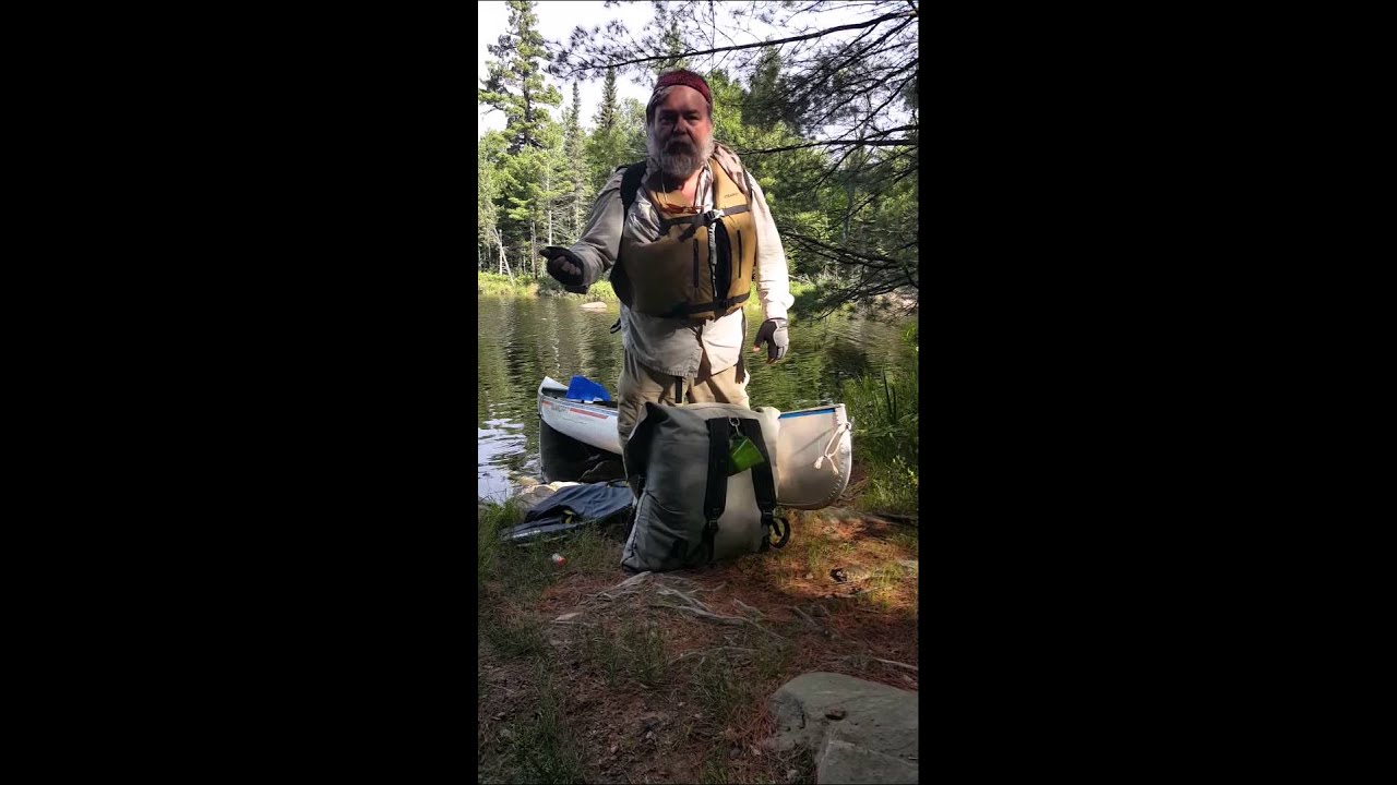 Portaging with a Tumpline (Carry Two Packs)