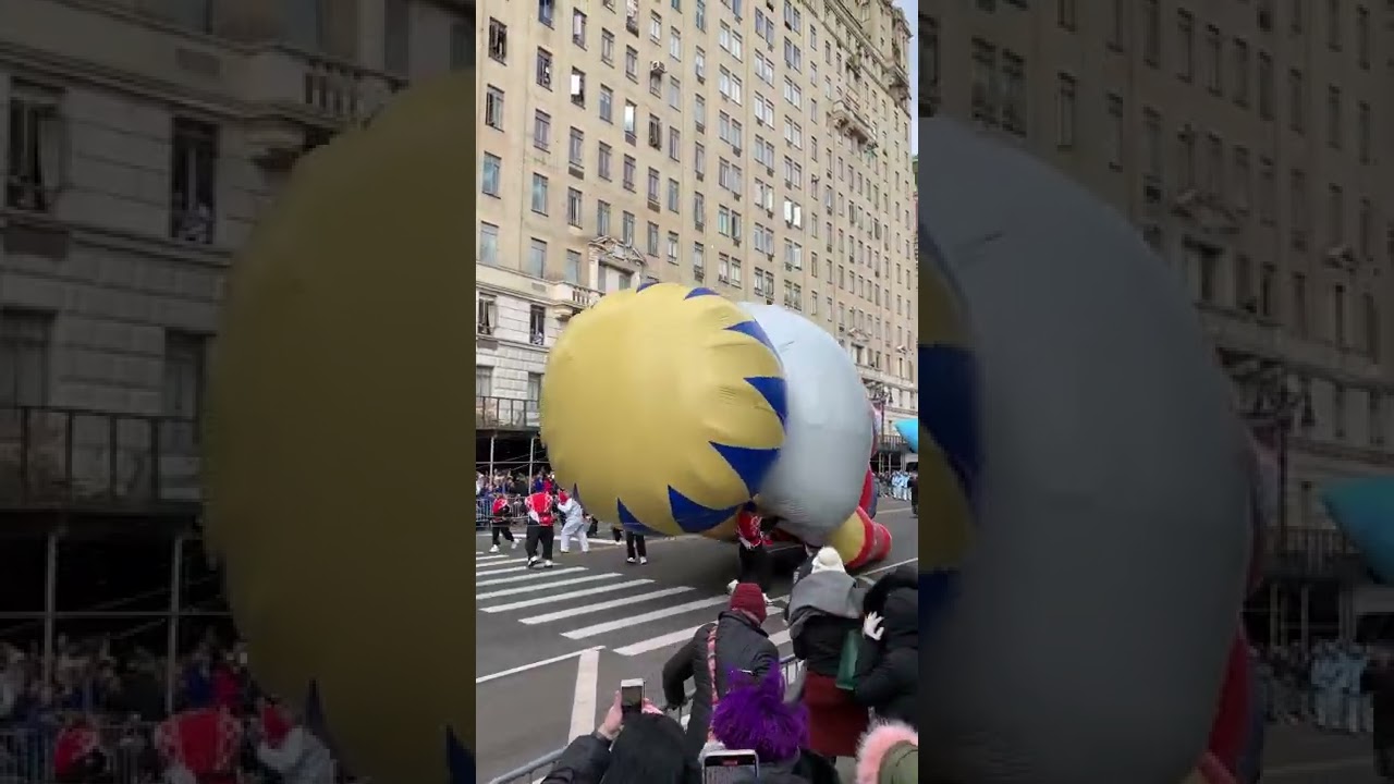 Inflatable nutcracker balloon knocks parade marcher to the ground