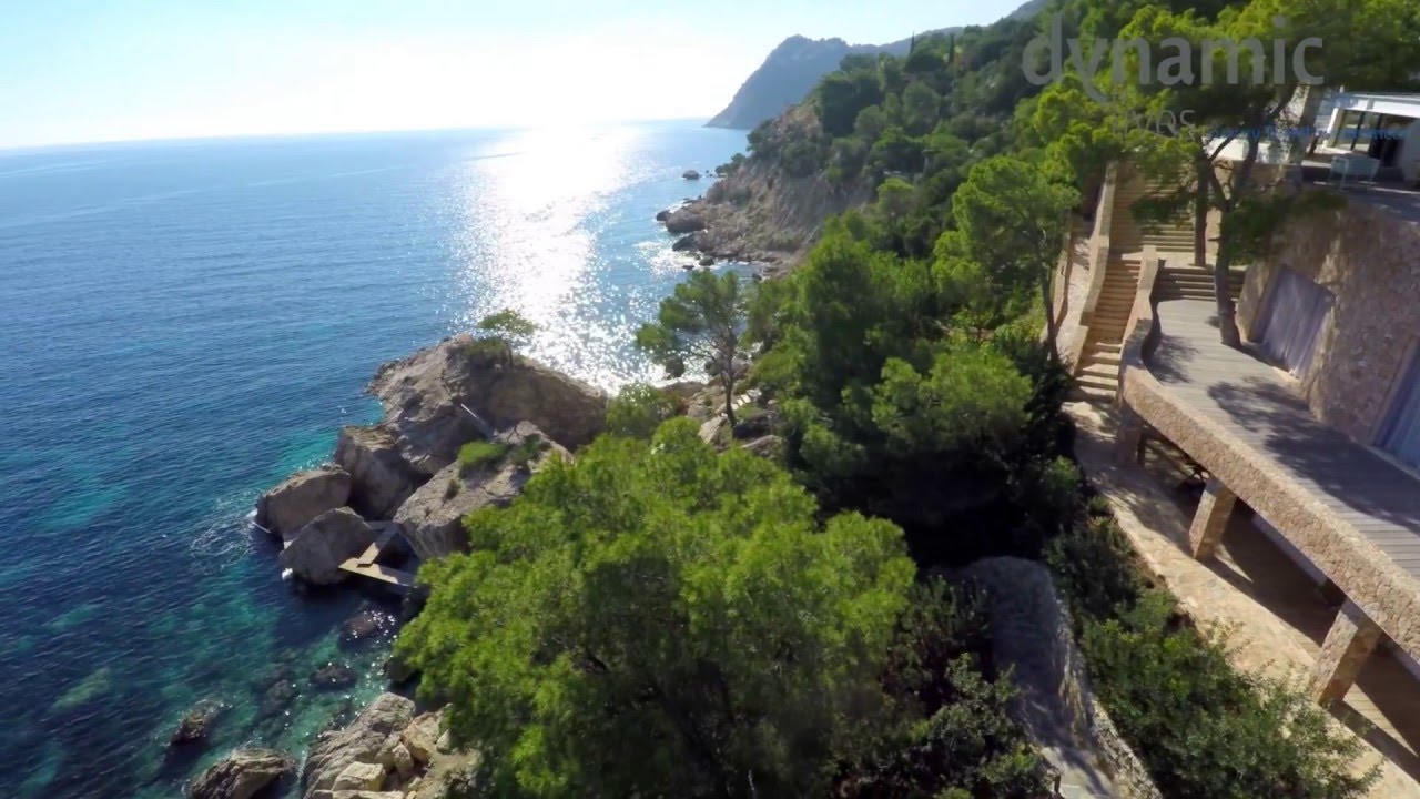 Modern front line Ibiza Villa in Es Cubells with secluded beach and full staff