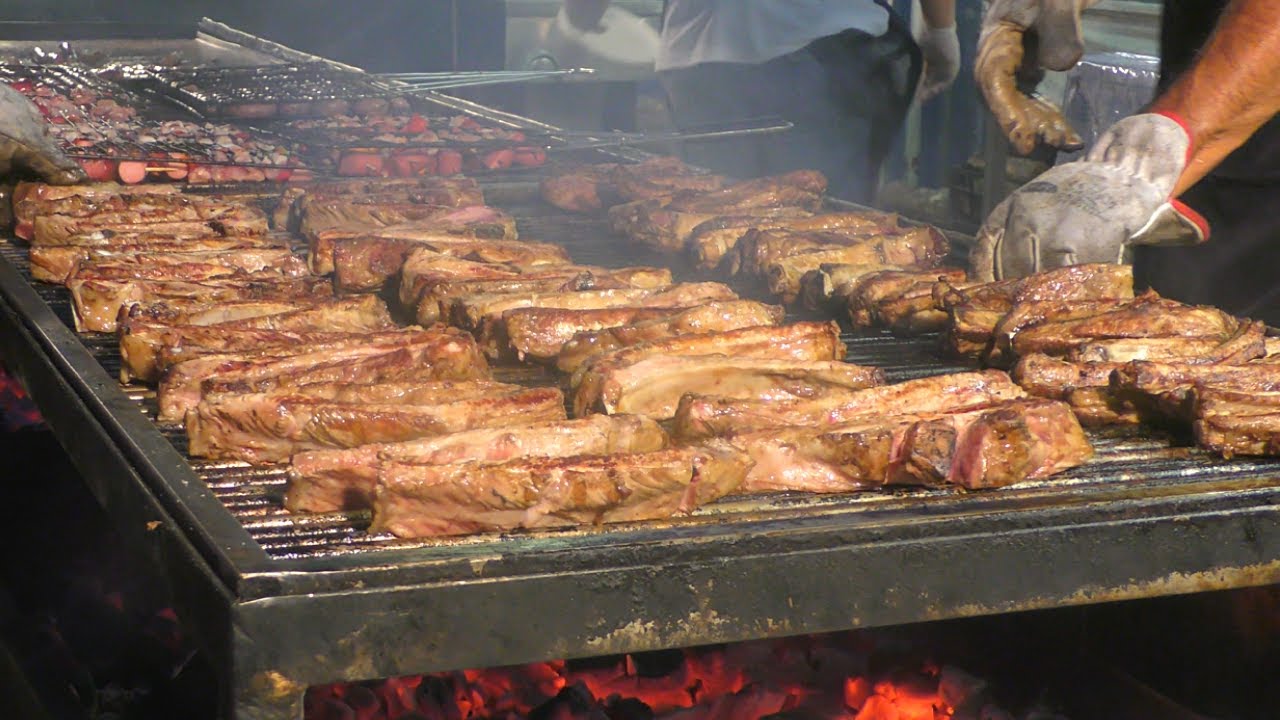 Italy Street Food Event. Ribs, Sausages, Melted Cheese with Ham, Huge Filled Burgers, Skewers
