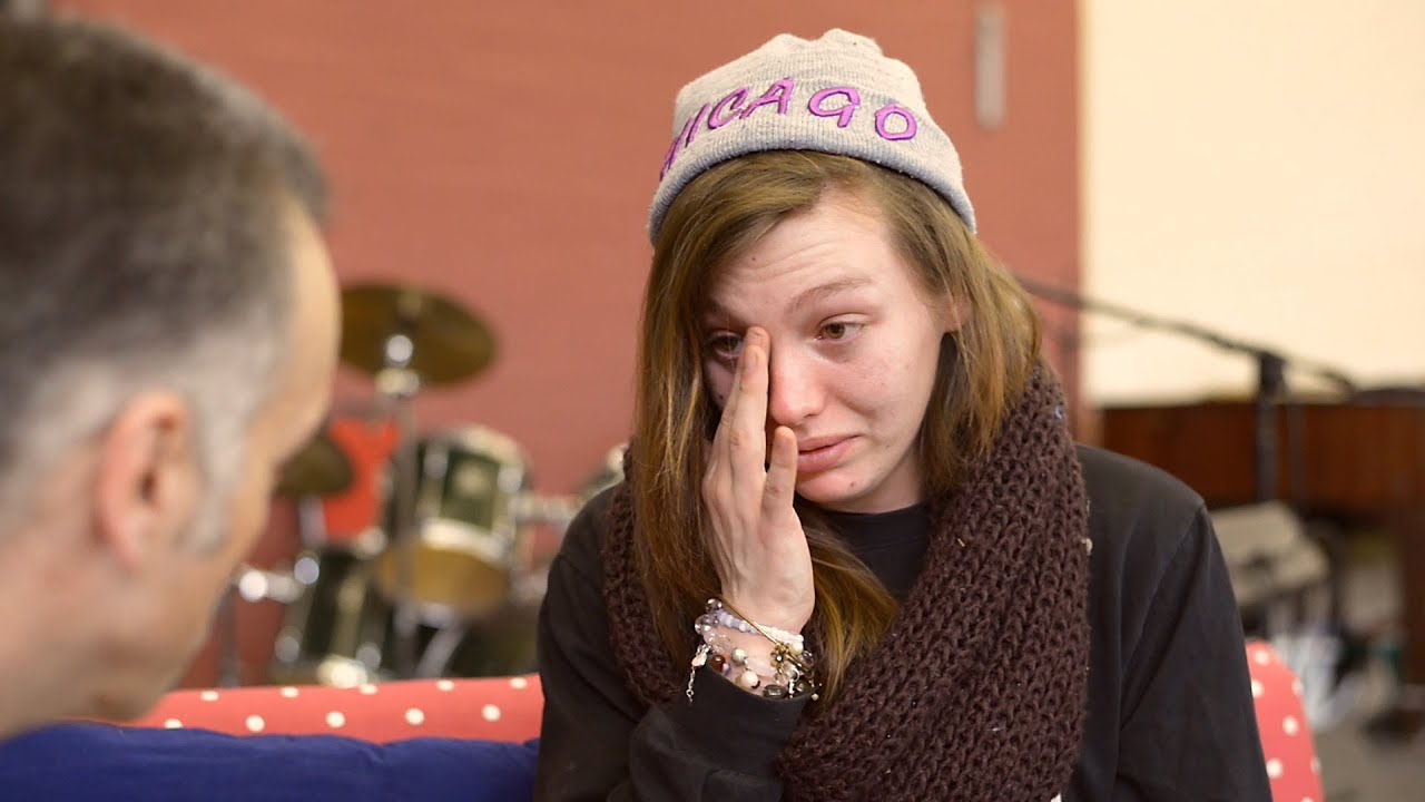 Girl is deeply moved while Christian prays for her