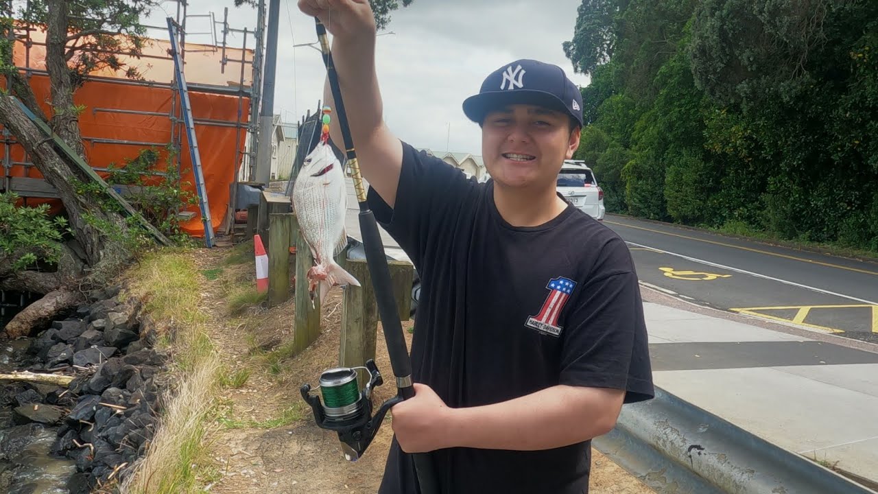 TEACHING ME NEPHEW HOW TO FISH AND COOK OUTDOORS. 