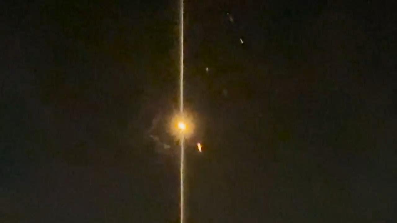 Iranian missiles or drones being intercepted in the sky above Jordan